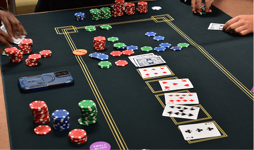 Casino-themed event table with cards and chips
